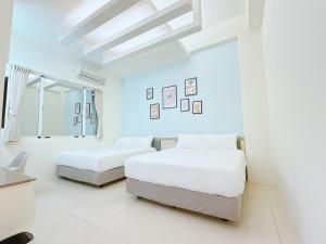 Postel nebo postele na pokoji v ubytování MuyuTime B&B