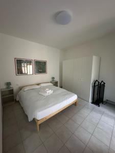 Postel nebo postele na pokoji v ubytování Giuditta Room