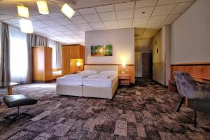 Uma cama ou camas num quarto em Hotel Beethoven