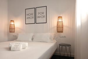 Postel nebo postele na pokoji v ubytování Hostal Boutique Bajío + 28 fotografií