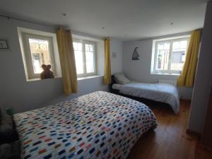 Postel nebo postele na pokoji v ubytování Appartement cosy à 300 m de la plage