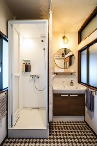 a bathroom with a shower and a sink at 伊豆の情景 Izu Nostalgia in Ito +59 photos