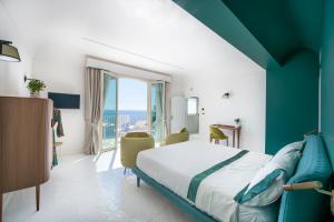 Postel nebo postele na pokoji v ubytování Infinity Suites