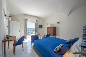 Postel nebo postele na pokoji v ubytování Infinity Suites