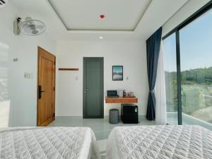 Photo de la galerie de l'établissement Blue Star Viên Hotel, à Binh Tien 7 autres photos