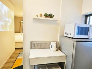 A cozinha ou cozinha compacta de 편의점까지10초걸리는아늑한아파트 신주쿠2분 역5분 16평 최대4명 부엌침실 장기체류환영