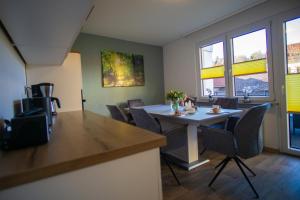 a dining room with a table and chairs at Ferienwohnung Busch 4 in Bad Sachsa