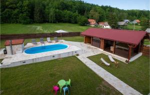 an aerial view of a backyard with a swimming pool at Stunning Home In Gospic in Gospić +23 photos