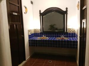 Postel nebo postele na pokoji v ubytování Hotel Hacienda Margot