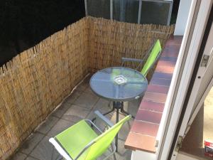 a table and two chairs on a patio at HertenFlats - Apartment Balkon in Herten