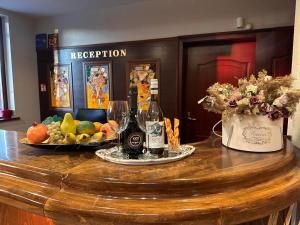 a table with a bunch of fruit and wine glasses at Family Hotel St Stefan Nessebar in Nesebar