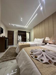 A bed or beds in a room at Inside Pyramids Hotel