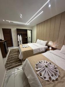 A bed or beds in a room at Inside Pyramids Hotel