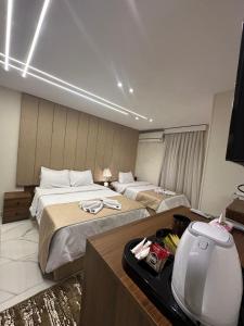 A bed or beds in a room at Inside Pyramids Hotel