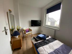 Postel nebo postele na pokoji v ubytování Haus Sunshine - Ferienwohnung Sunshine 1