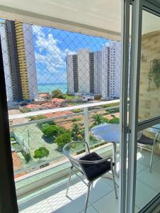 Balkon atau teras di Varandas Premium flat