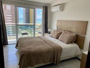 Tempat tidur dalam kamar di Varandas Premium flat +24 foto