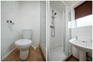 a bathroom with a toilet and a shower and a sink at The Douglas Hotel in Hartlepool