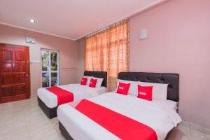 Ένα ή περισσότερα κρεβάτια σε δωμάτιο στο Hotel O Rg Motel