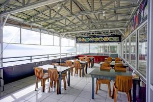 Restaurace v ubytování Collection O Gapura Hotel Near Parapat Penatapan Danau Toba