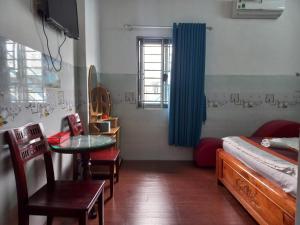 Postel nebo postele na pokoji v ubytování Khách Sạn Nguyên Trung