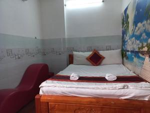 Postel nebo postele na pokoji v ubytování Khách Sạn Nguyên Trung