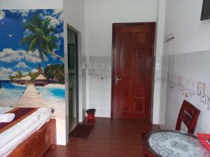 Postel nebo postele na pokoji v ubytování Khách Sạn Nguyên Trung