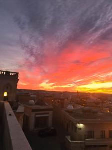 a view of a sunset from the roof of a building at Mons Masius Hotel Teras in Midyat