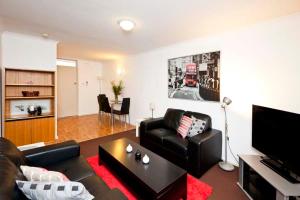 a living room with a couch and a coffee table at Cunningham Terrace 1 in Perth