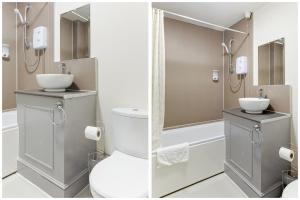 a bathroom with a toilet and a shower at The Green Man Pub and Hotel by OYO in London