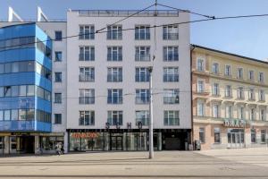 a large white building on a city street at Shone apartment old town 2 bedroom in Bratislava