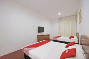 Postel nebo postele na pokoji v ubytování OYO 89562 Hotel Shalimar