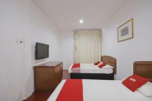 Postel nebo postele na pokoji v ubytování OYO 89562 Hotel Shalimar