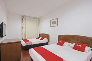 Postel nebo postele na pokoji v ubytování OYO 89562 Hotel Shalimar