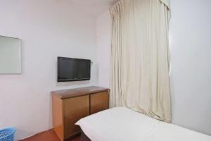TV a/nebo společenská místnost v ubytování OYO 89562 Hotel Shalimar