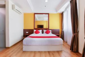 Postel nebo postele na pokoji v ubytování Collection O Hotel Super Cowboy