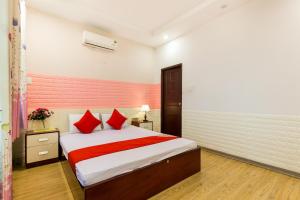 Postel nebo postele na pokoji v ubytování OYO 373 Habana Hotel