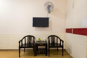 TV a/nebo společenská místnost v ubytování OYO 373 Habana Hotel