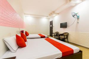 Postel nebo postele na pokoji v ubytování OYO 373 Habana Hotel