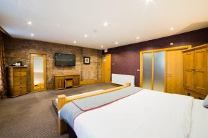 Postel nebo postele na pokoji v ubytování OYO Imperial Hotel