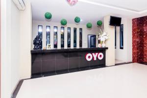 TV a/nebo společenská místnost v ubytování Capital O 1867 Kara Guest House