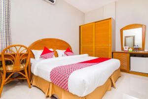 Postel nebo postele na pokoji v ubytování Capital O 1867 Kara Guest House