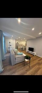 a living room with a couch and a table at an der Elbe in Freiburg - Elbe +31 photos