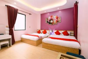 Postel nebo postele na pokoji v ubytování Tuan Anh Hotel
