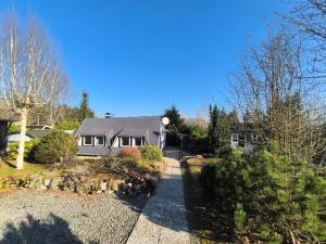 a house with a garden and a driveway at Eifel Residence in Gerolstein