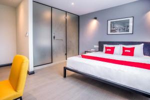 Postel nebo postele na pokoji v ubytování OYO 89576 Mokka Hotel