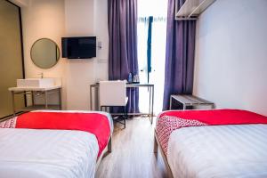 Postel nebo postele na pokoji v ubytování OYO 89576 Mokka Hotel