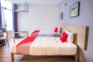 Postel nebo postele na pokoji v ubytování OYO 89576 Mokka Hotel