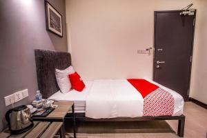 Postel nebo postele na pokoji v ubytování OYO 89576 Mokka Hotel
