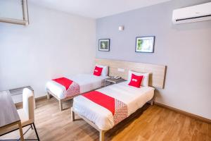 Postel nebo postele na pokoji v ubytování OYO 89576 Mokka Hotel